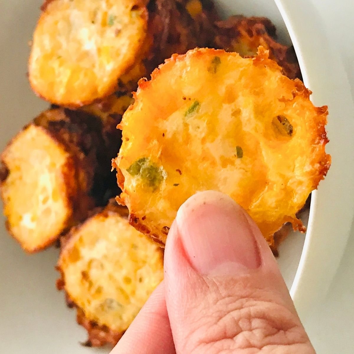 Chocolate chip cookies with two cups of espresso coffee on a wooden table.