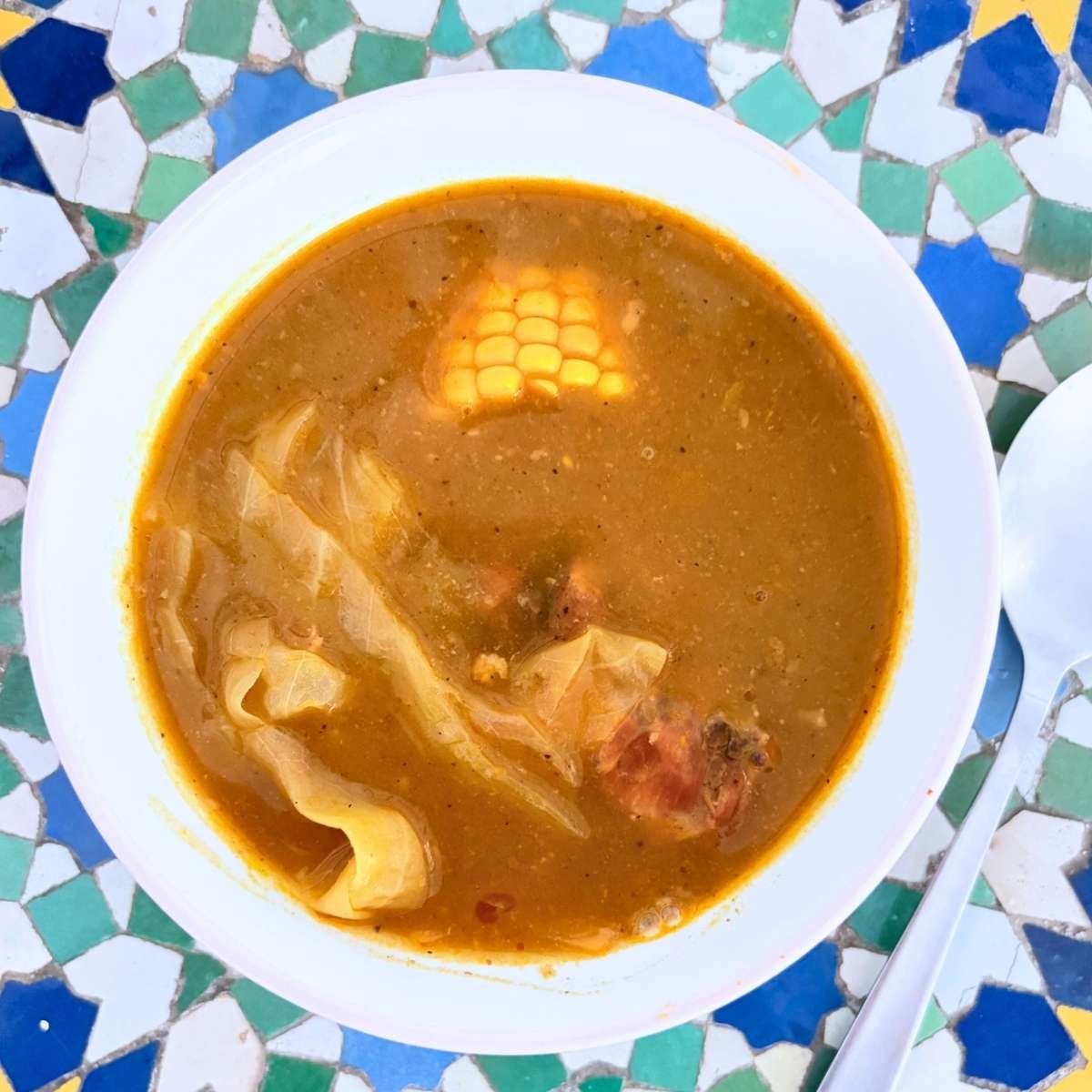 High protein Dominican sancocho in large pot with yuca platano and auyama